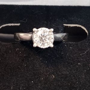 BEAUTIFUL 10kt white gold .50 carat ring size 5.  The diamond is stunning!